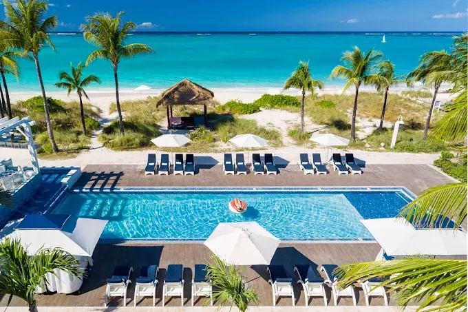 A Beaches Turks & Caicos pool deck at golden hour